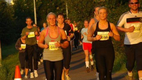 Runners competing in the Midnight Sun Half Marathon
